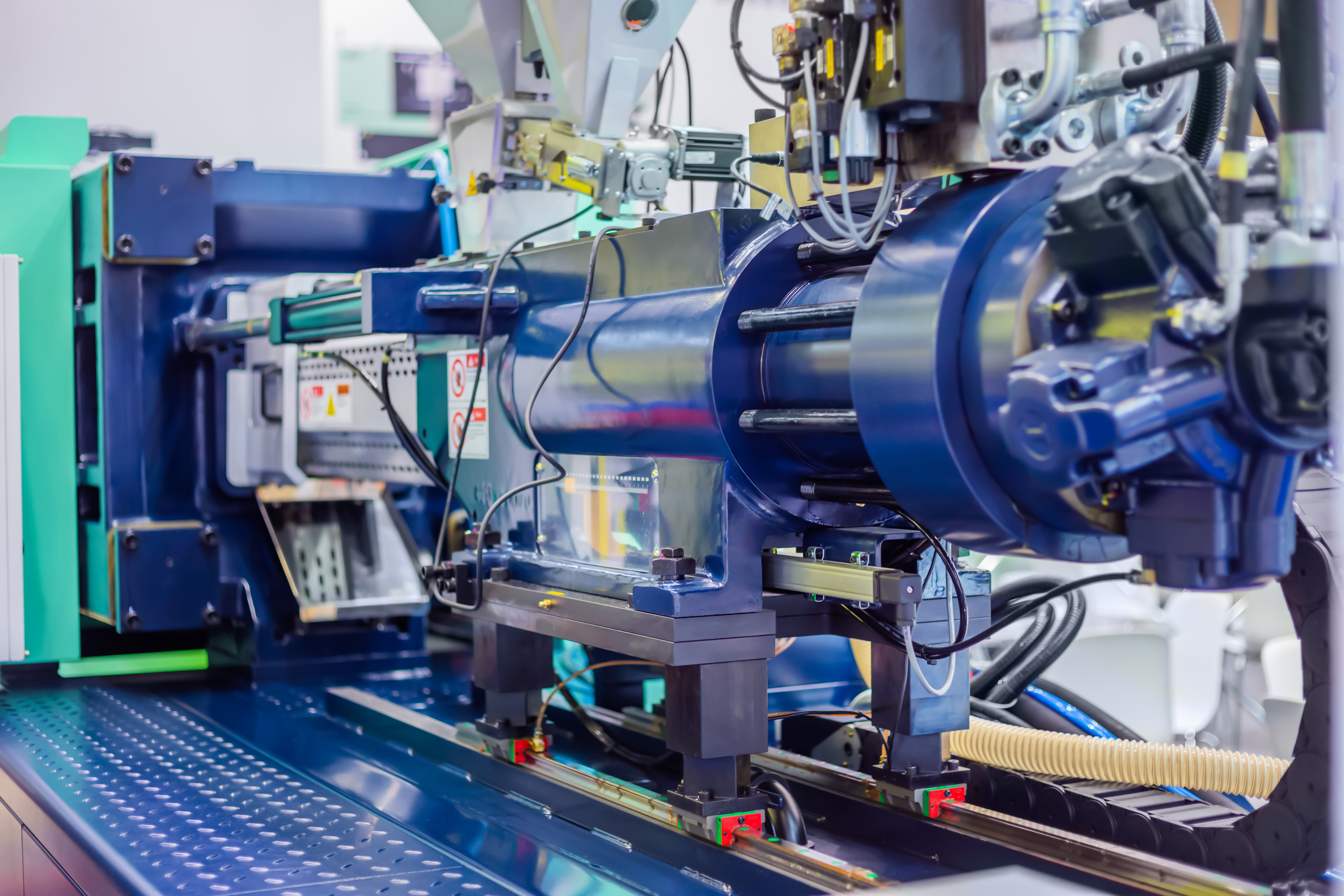 A thermoplastic injection molding machine.