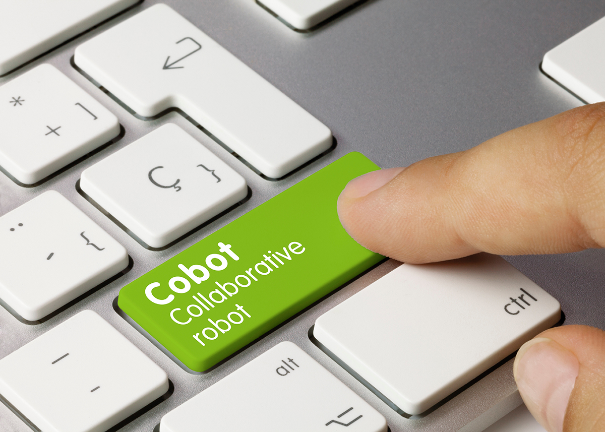 A keyboard with a green key labeled “Cobot Collaborative robot.”