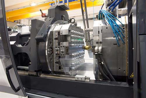 Injection molding machine in a large factory.