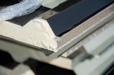 Metal roofing with polyurethane foam insulation under it.