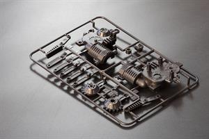 Plastic injection molded parts are still on the runners.
